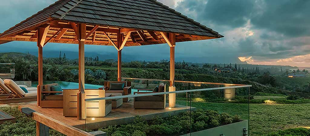 Back deck looking over the grass and ocean at Sweet Escape villa rental