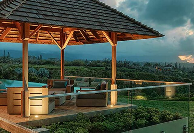 Back deck looking over the grass and ocean at Sweet Escape villa rental