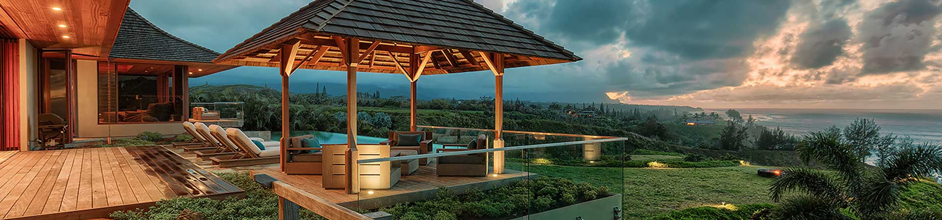 Back deck looking over the grass and ocean at Sweet Escape villa rental